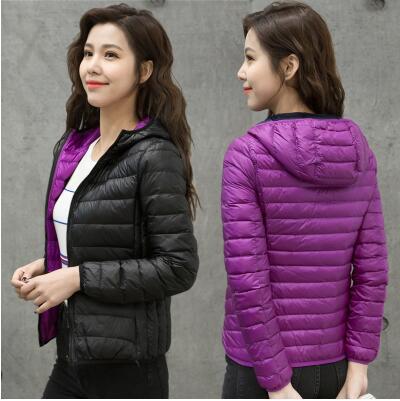 Damen Daunenjacke, schwarz und lila, Kapuze, warm, modisch, Winterbekleidung.