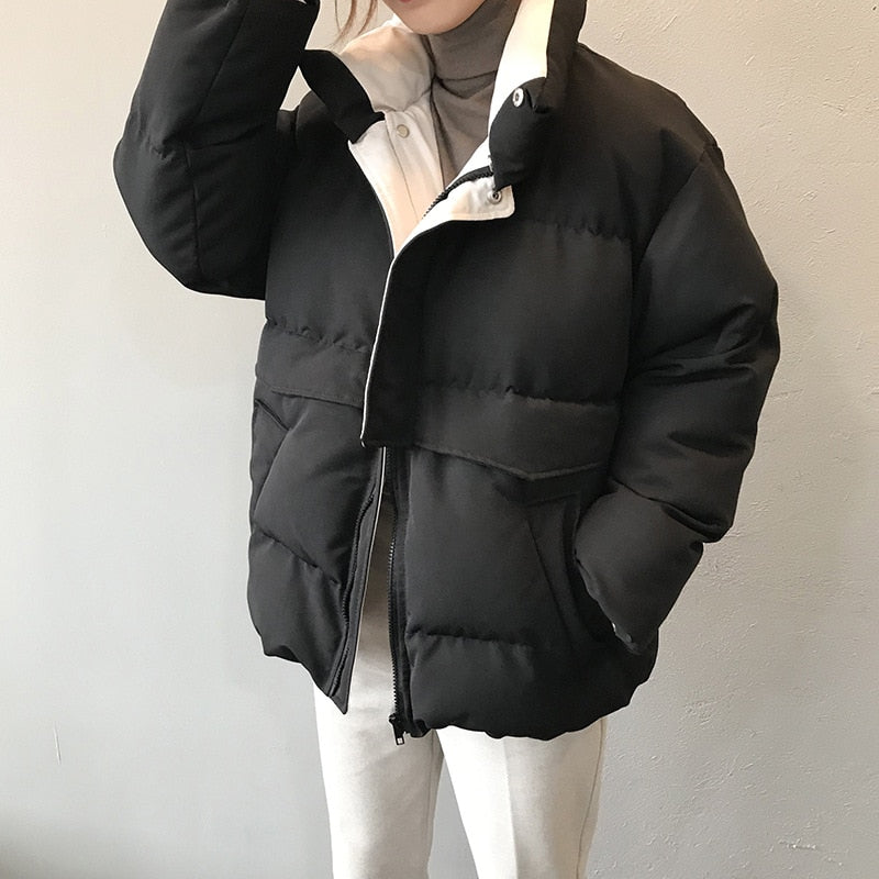 Schwarze Daunenjacke Damen, warm, modisch, Wintermantel, Reißverschluss, Stehkragen, elegant.