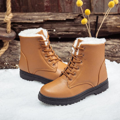 Braune Winterstiefel mit Fellfutter, rutschfeste Sohle, ideal für kaltes Wetter.