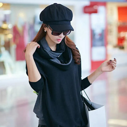 Frau mit schwarzem Hut und Sonnenbrille, trägt schwarzen Schal, modisch, elegant, Shopping.