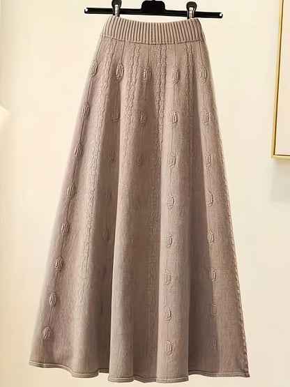 Langer beiger Strickrock, A-Linie, mit Muster, Damenmode, elegant, Herbst-Winter-Kollektion.
