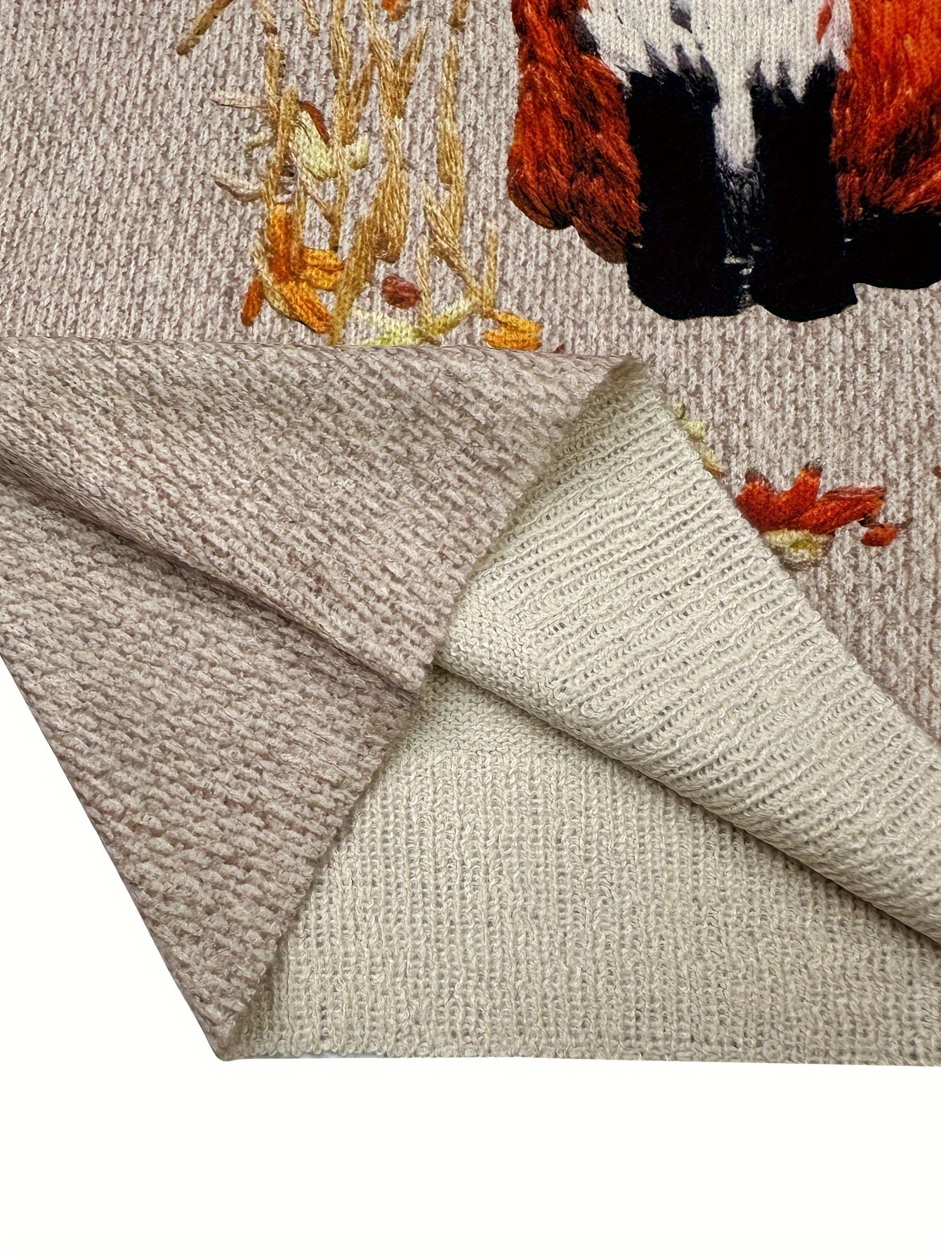Beige Strickdecke mit Fuchs-Motiv, weiches Material, Herbstdesign, gemütliche Wohntextilien.