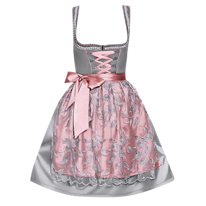 Graues Dirndl mit rosa Schürze, Spitzenmuster, traditionelles bayerisches Kleid, Oktoberfest.
