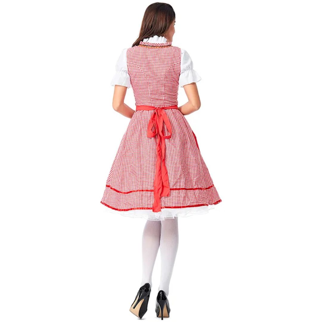 Frau im roten Dirndl mit Karomuster, weiße Bluse, Rückansicht, traditionelle Tracht.