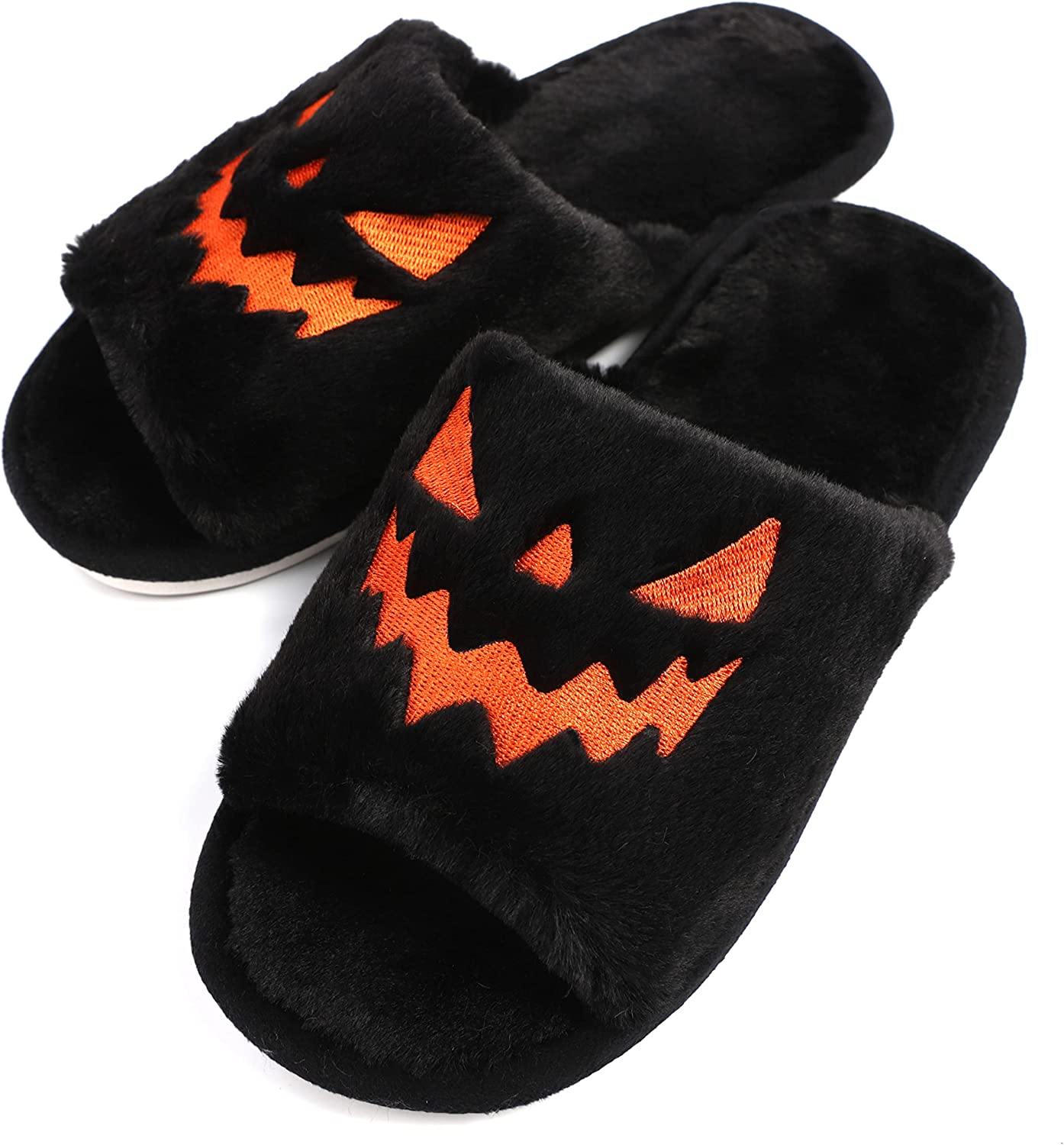 Schwarze Plüsch-Hausschuhe mit orangefarbenem Halloween-Kürbisgesicht, gemütlich und warm.