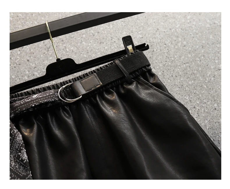Schwarzer Lederrock mit Gürtel, D-Ring, elastischem Bund, modisch, elegant, Damenmode.