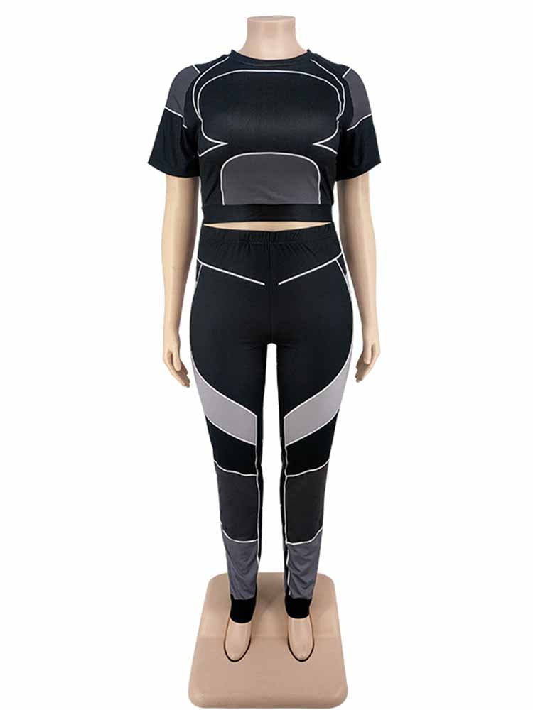Schwarzes Damen-Sportset, kurzärmeliges Oberteil und Leggings, mit grauen Akzenten.