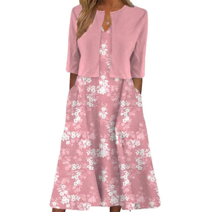 Rosa Damenkleid mit Blumenmuster, dreiviertel Ärmel, elegantes Design, Sommermode.