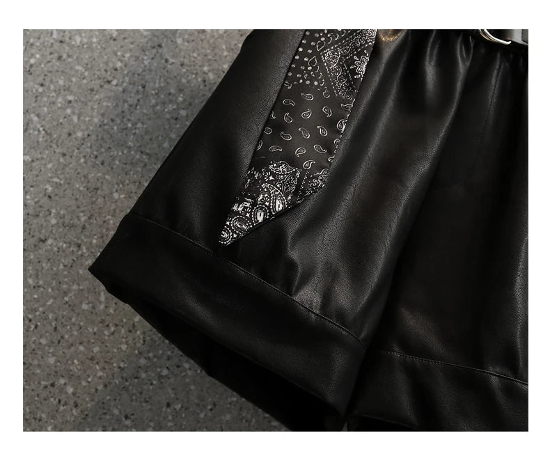 Schwarzer Lederrock mit Paisley-Muster, modisch, elegant, Damenbekleidung, Detailansicht.