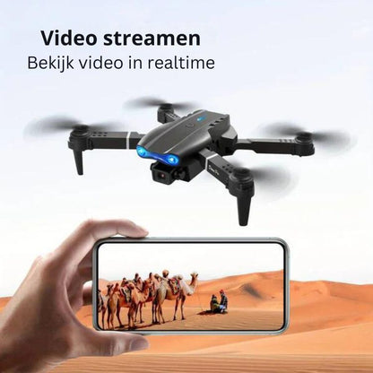Schwarze Drohne mit Kamera, Wüste, Smartphone-Display, Video-Streaming, Echtzeit-Aufnahme.