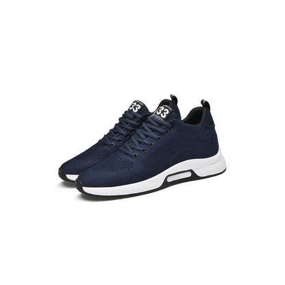 Dunkelblaue Sportschuhe, atmungsaktiv, mit weißer Sohle, ideal für Herren, modisch und bequem.