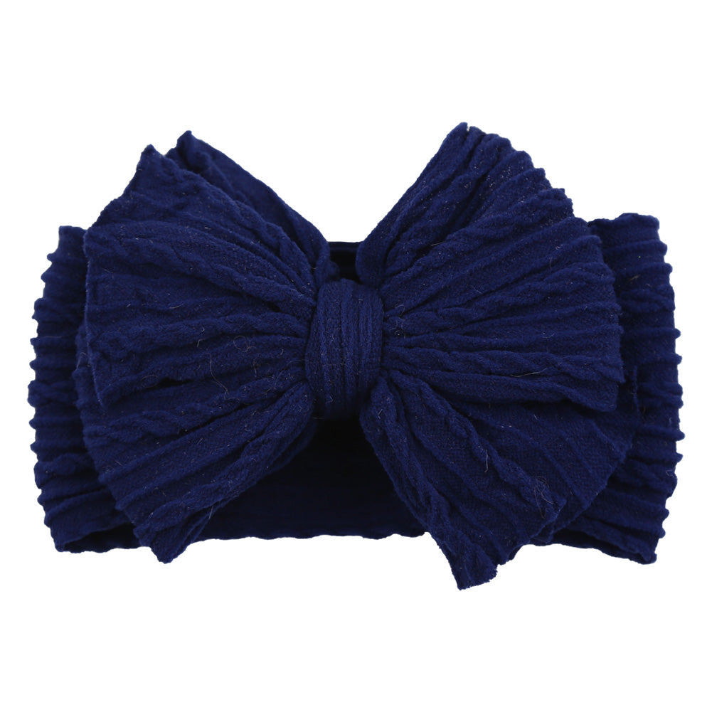 Dunkelblaues Stirnband mit großer Schleife, geripptes Design, modisches Accessoire für Damen.