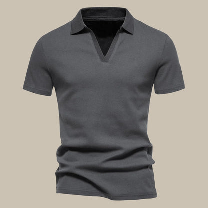 Dunkelgraues Herren-Poloshirt aus Baumwolle, kurzärmelig, klassischer Kragen.