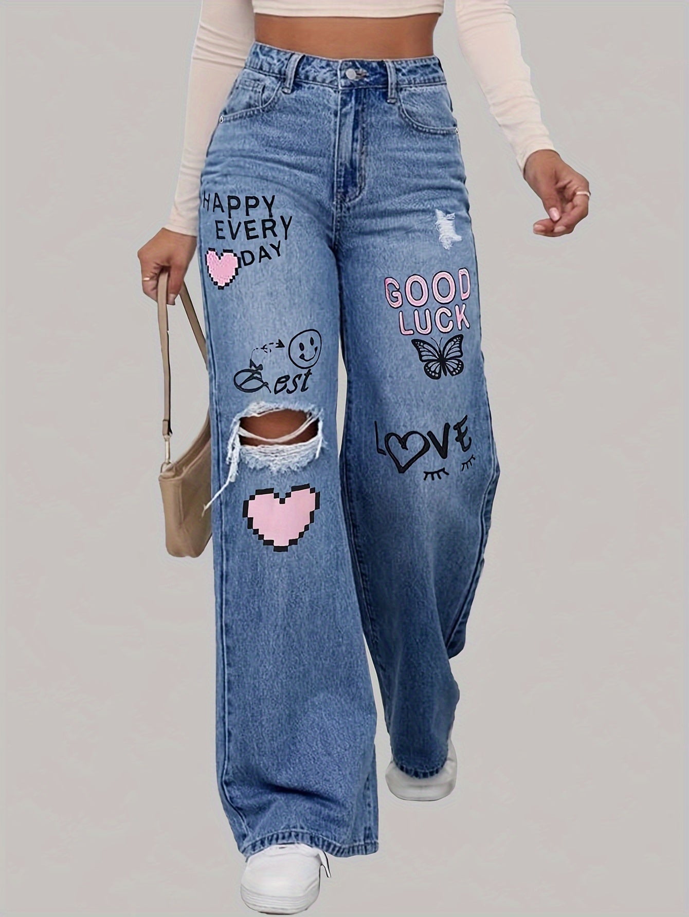 Damen-Jeans mit Aufnähern, blauer Denim, weites Bein, Streetwear, modisch, lässig.
