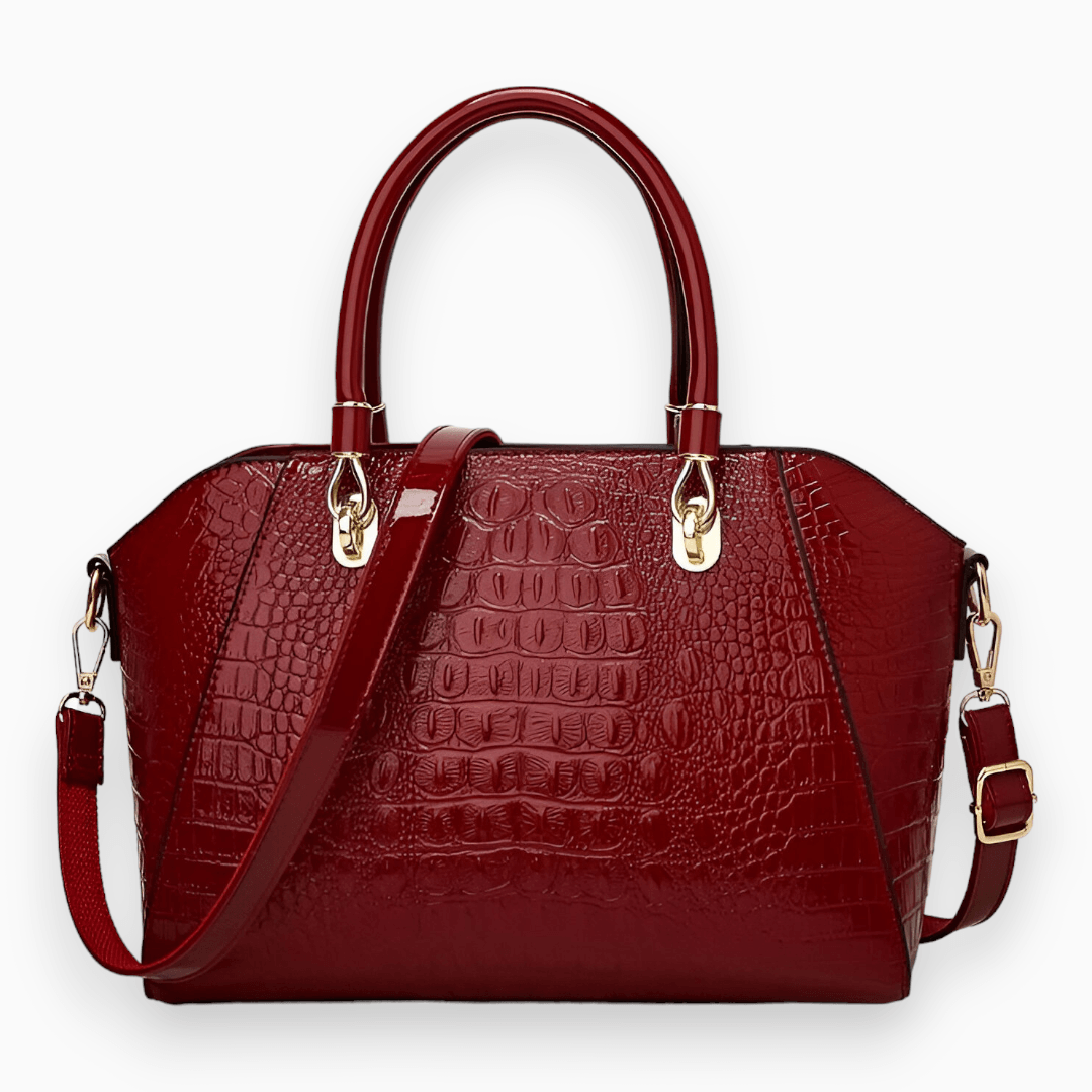 Rote Damenhandtasche aus Leder mit Krokodilprägung, abnehmbarer Schulterriemen, goldene Beschläge.