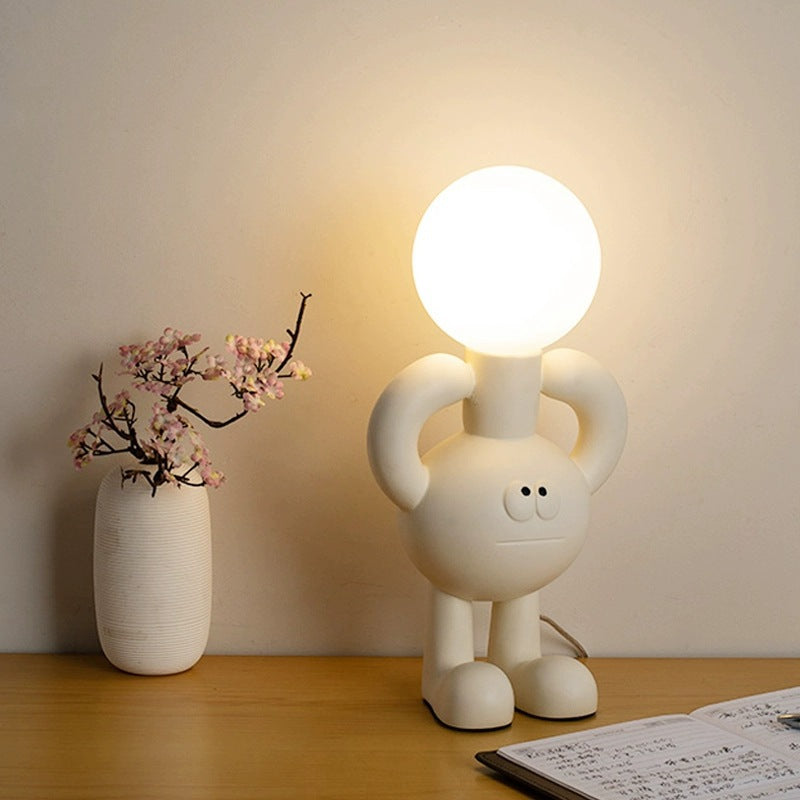 Lekfull bordslampa med glaskula - Glombra