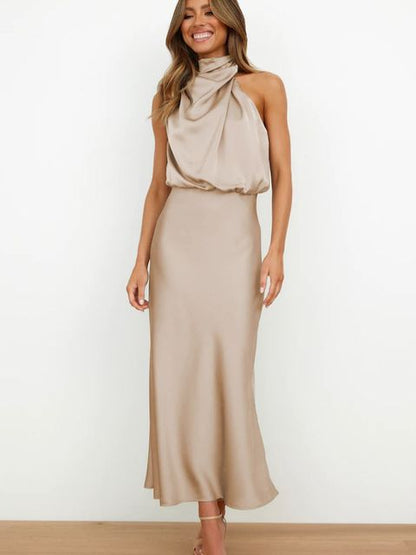 Elegantes, ärmelloses Abendkleid in Beige, lang, rückenfrei, ideal für Partys und Hochzeiten.