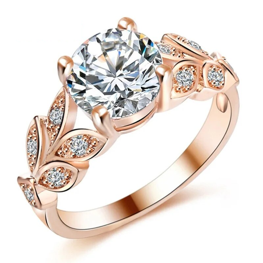 Roségoldener Verlobungsring mit großem Zirkonia und filigranem Blattdesign, elegant und funkelnd.