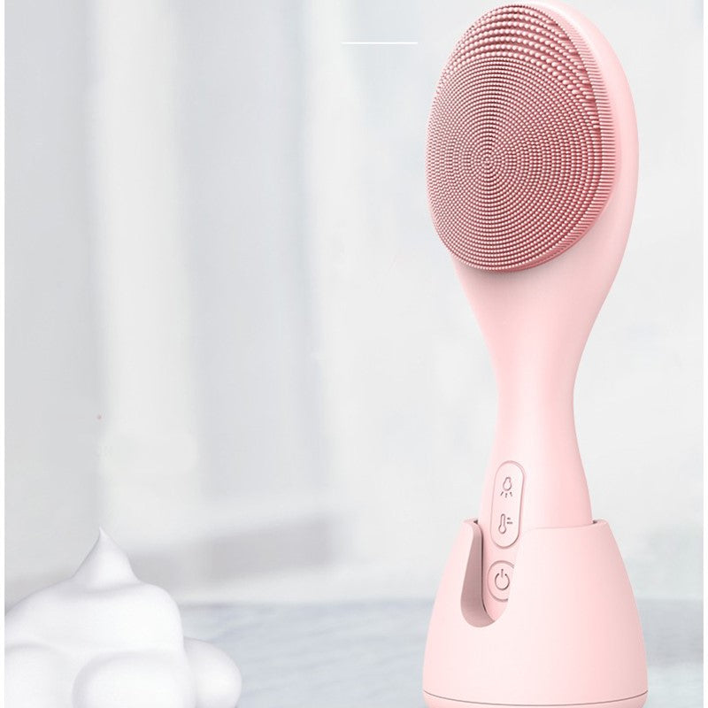 Rosa elektrischer Gesichtsreiniger aus Silikon, USB-betrieben, vier Lichtmodi.
