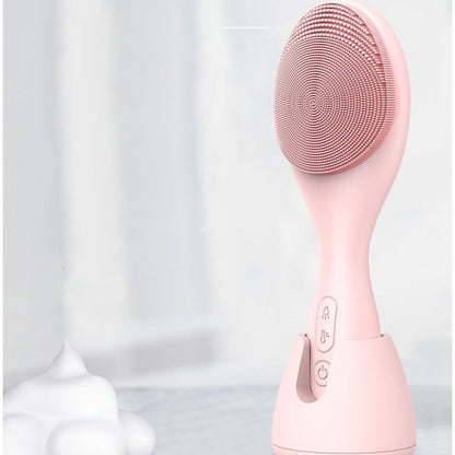 Rosa elektrischer Gesichtsreiniger aus Silikon, USB-betrieben, vier Lichtmodi.