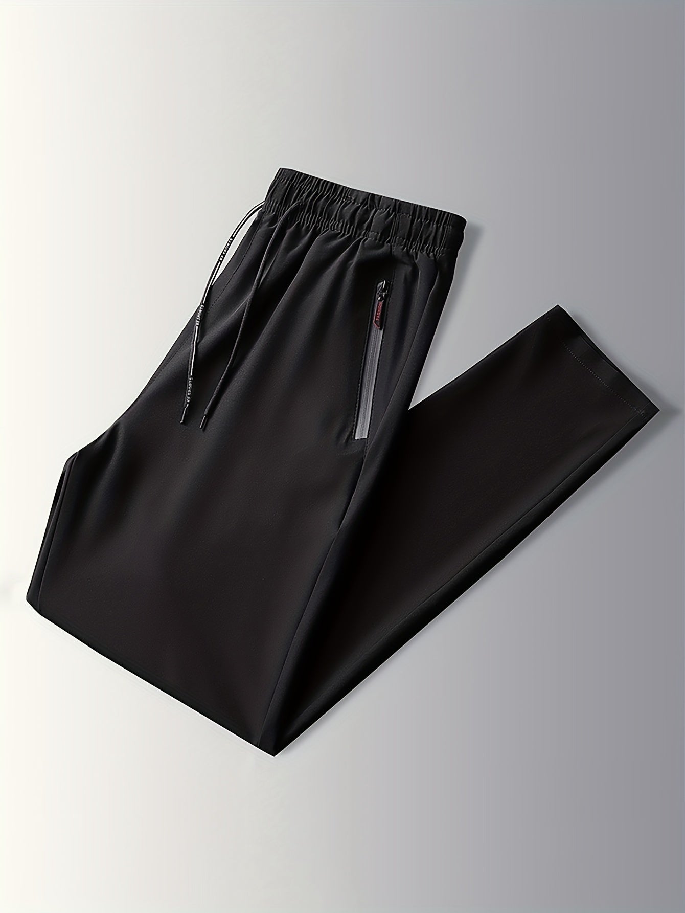 Schwarze Jogginghose mit Reißverschlusstaschen, elastischem Bund, Sportbekleidung Herren.