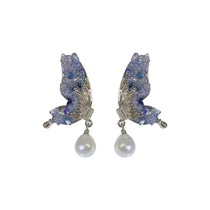 Silberne Ohrringe mit blauen Kristallen und Perlenanhänger, eleganter Schmuck für Damen.