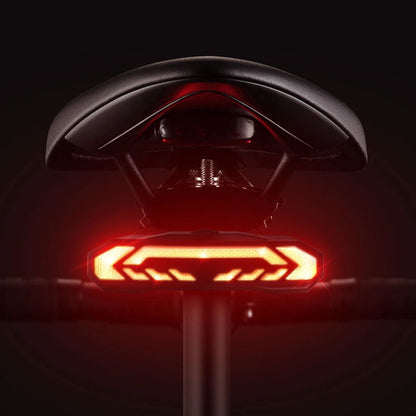 Fahrradsattel mit rotem LED-Rücklicht, schwarz, ergonomisch, für sicheres Nachtfahren.