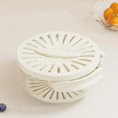 Weiße Salatschleuder aus Kunststoff mit Deckel, ideal zum Trocknen von Salat und Gemüse.