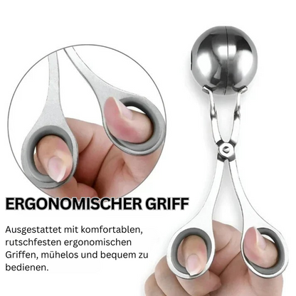 Ergonomischer Fleischbällchenformer aus Edelstahl mit rutschfesten Griffen für einfache Handhabung.