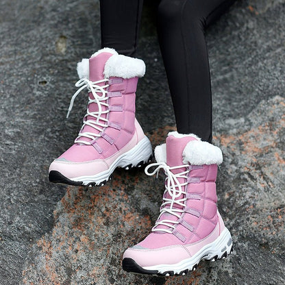Rosa Damen-Winterstiefel mit weißem Kunstfell, rutschfeste Sohle, ideal für kaltes Wetter.