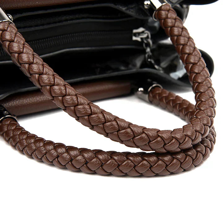 Braune geflochtene Lederhandtasche mit Reißverschluss, elegantes Design, Damenmode Accessoire.