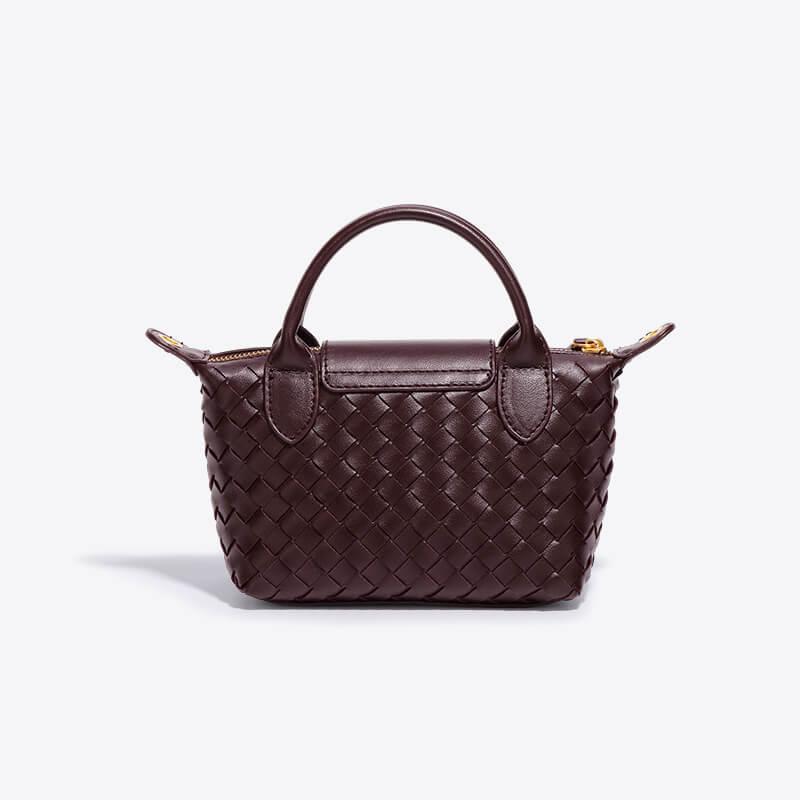 Braune geflochtene Handtasche aus Leder, elegant, modisch, Damenaccessoire, stilvoll.