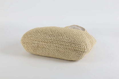 Beige handgefertigte Strohtasche, umweltfreundlich, Sommermode, Strandaccessoire.