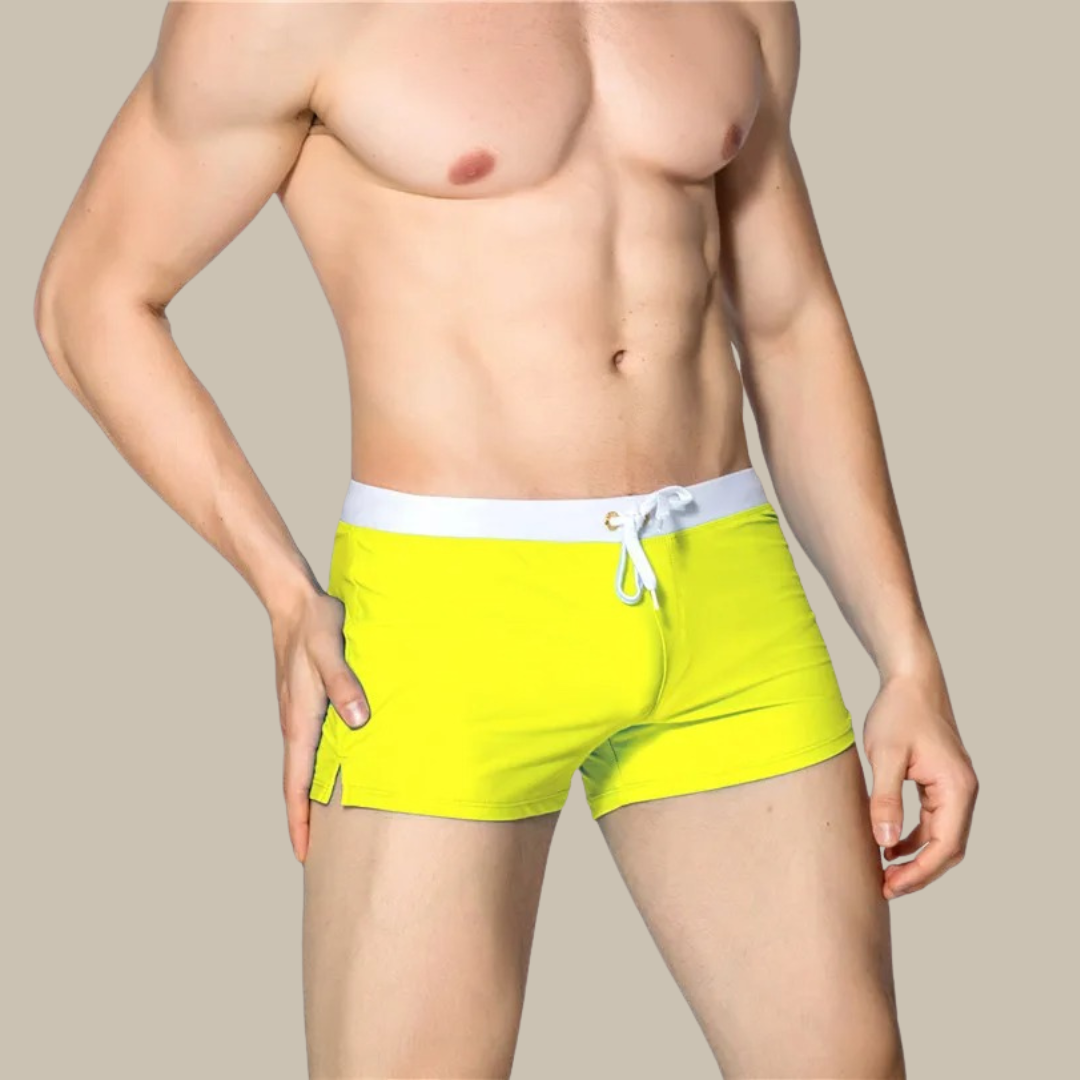 Gelbe Herren-Badeshorts mit weißem Bund, sportlich, bequem, ideal für Sommer und Strand.