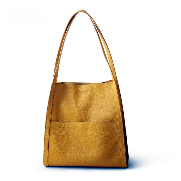 Gelbe Ledertasche mit langen Henkeln, elegantes Design, Damenhandtasche, modisch und geräumig.