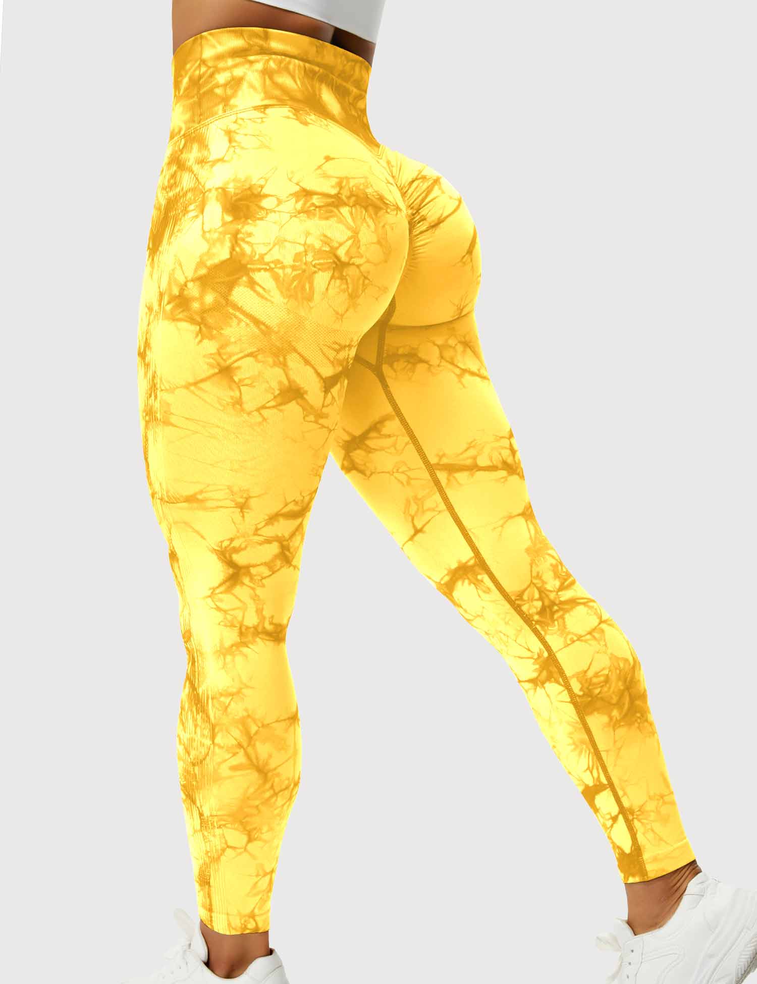 Gelbe Damen-Leggings mit Batikmuster, hoher Bund, elastisch, ideal für Sport und Freizeit.
