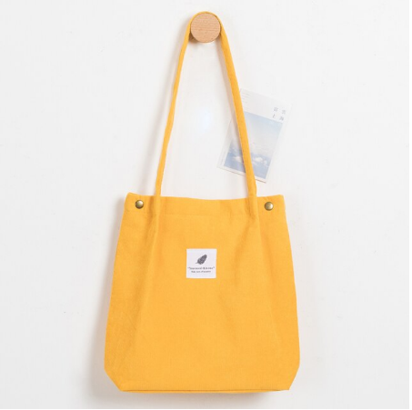 Gelbe Baumwolltasche mit langen Henkeln, minimalistisches Design, ideal für den Alltag.