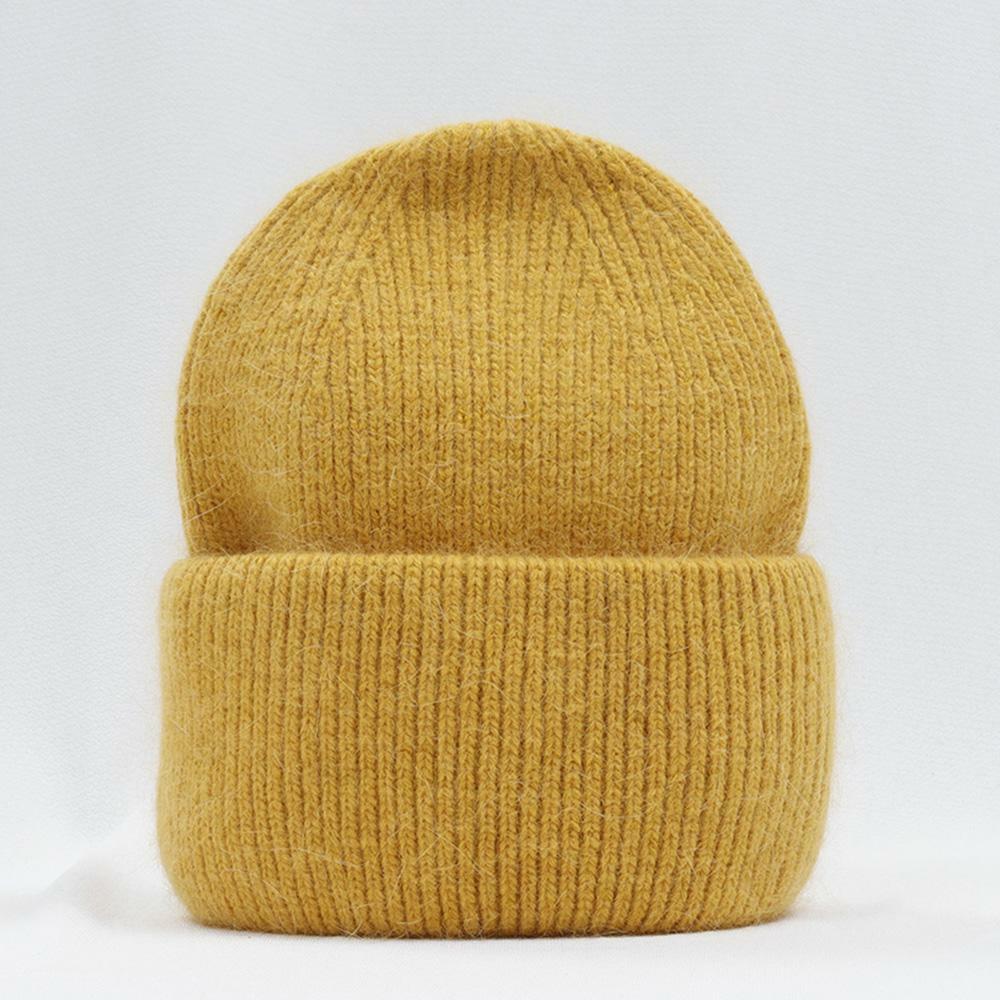 Gelbe Strickmütze aus Wolle, warm und modisch, ideal für Winterkleidung und Outdoor-Aktivitäten.