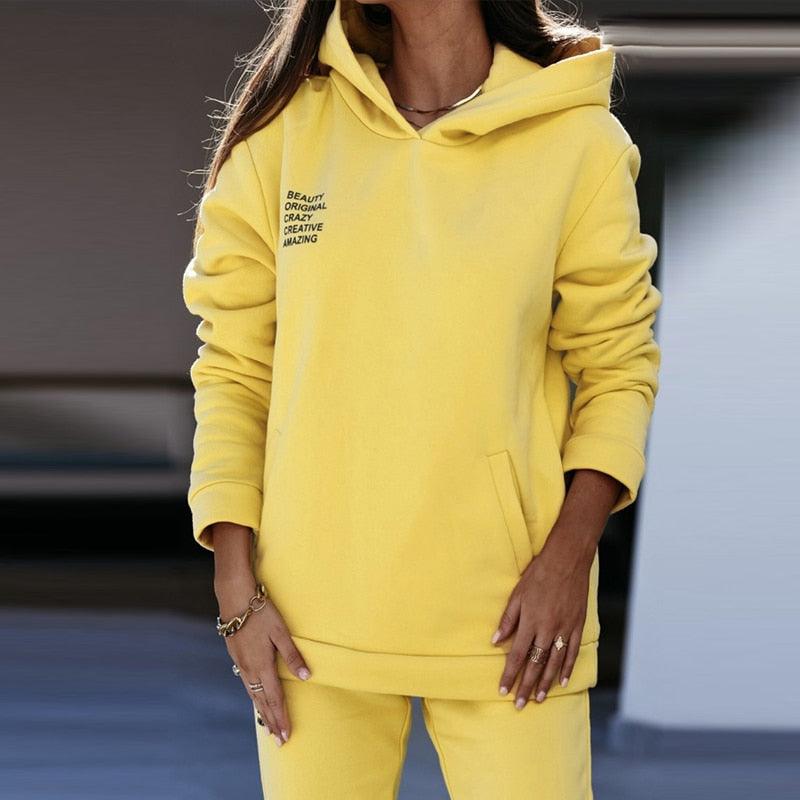 Gelber Damen-Hoodie aus Baumwolle, lässig, mit Kapuze, modisch, bequem, Freizeitkleidung.