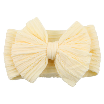 Gelbes Baby-Stirnband mit großer Schleife, weiches Baumwollmaterial, modisches Accessoire.