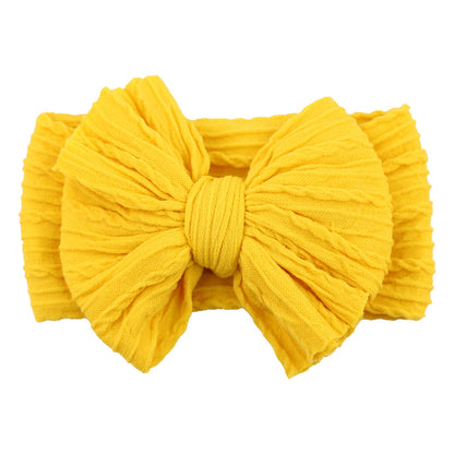 Gelbes Stirnband mit großer Schleife, Baumwolle, modisches Accessoire für Babys und Kleinkinder.