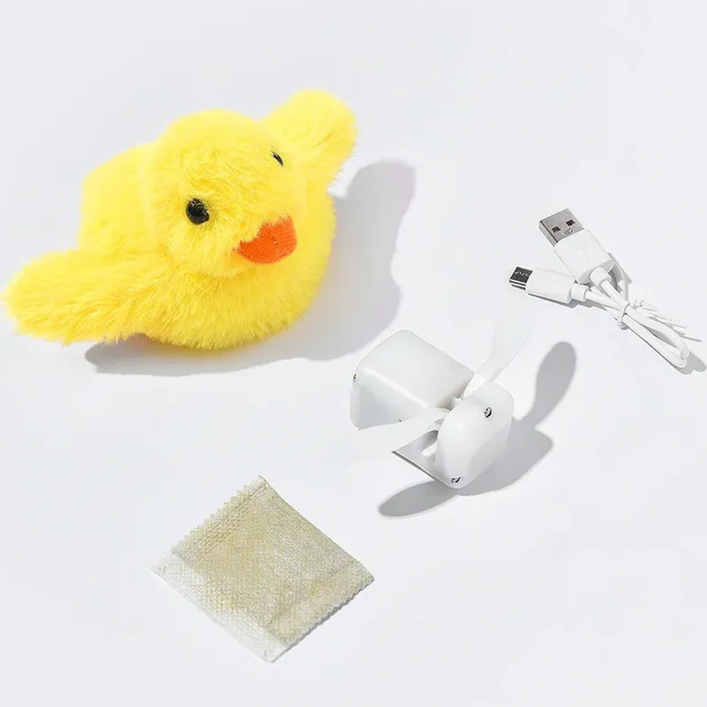 Gelbes Plüsch-Entenküken mit USB-Ventilator und Ladekabel auf weißem Hintergrund.