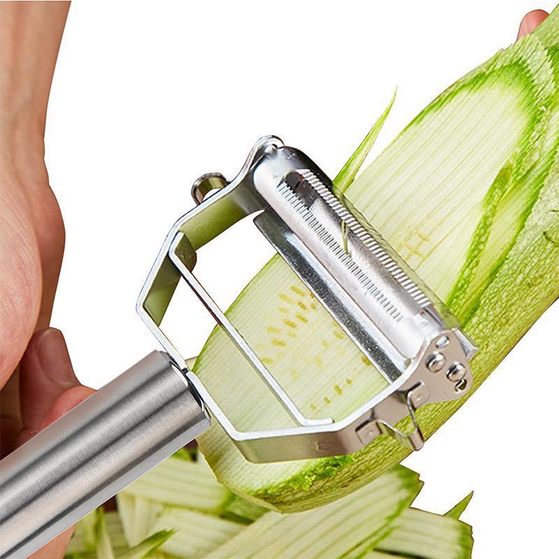 Edelstahl-Gemüseschäler schält Zucchini, ergonomischer Griff, scharfes Klingen-Design.
