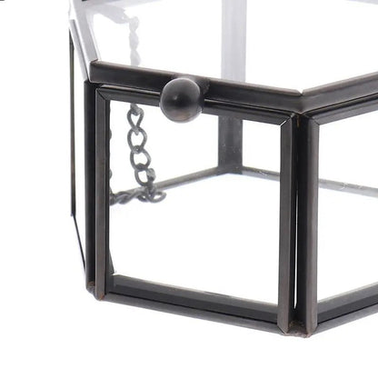 Schwarze Glasvitrine, sechseckig, Metallrahmen, dekorative Aufbewahrung, modern.