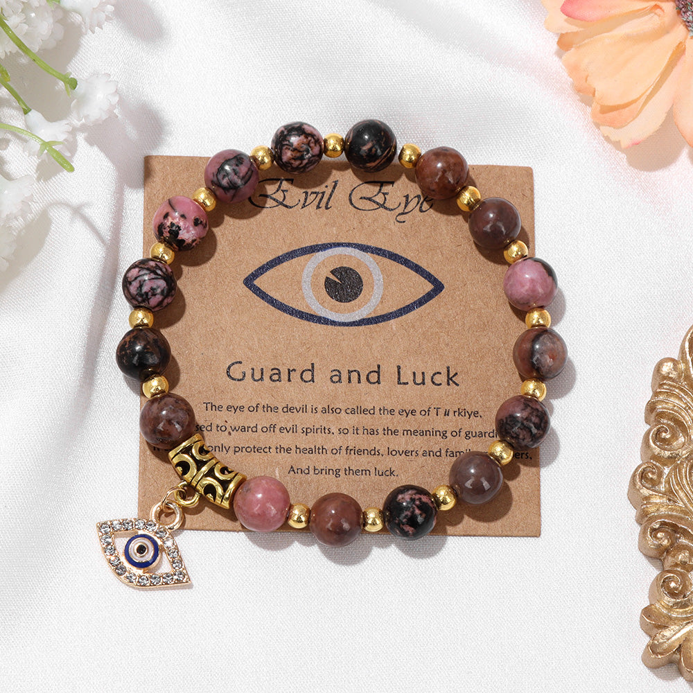 Armband mit bösem Blick Anhänger, Natursteinperlen, Glücksbringer, goldene Akzente.