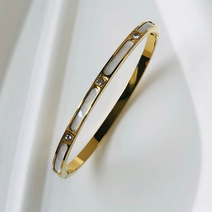 Goldenes Edelstahlarmband mit Zirkon, wasserdicht, luxuriöses Design für Damen.