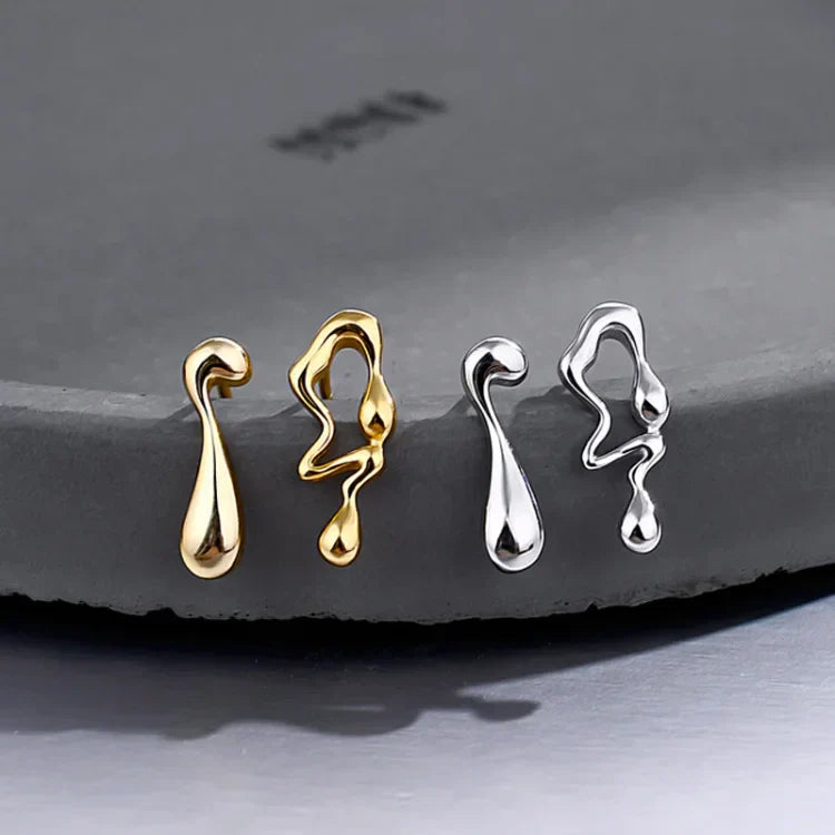Goldene und silberne Tropfen-Ohrringe, modernes Design, Schmuck, minimalistisch, elegant.