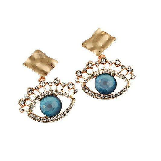 Goldene Ohrringe mit blauem Auge, Strasssteinen, modisches Schmuckdesign, Damenaccessoire.