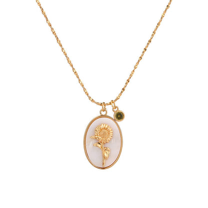 Goldene Halskette mit Sonnenblumen-Anhänger, elegantes Schmuckstück, Damenaccessoire.