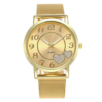 Goldene Damenarmbanduhr mit Herzdesign, Quarzwerk, Metallarmband, modisch, elegant.